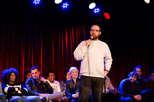 Me doing my first joke of the year on 50 First Jokes while fellow comics laugh at my butt. photo by Mindy Tucker. go here for the rest of the pics from 50 First Jokes